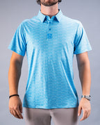 Men’s Margaritaville Rendezvous performance golf polo by Pins & Aces featuring a bright blue all-over pattern, short sleeves, collared neckline, and athletic fit.