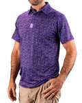 Men’s Doodle Guy Purple golf polo by Pins & Aces featuring an all-over purple, violet, blue, and green doodle-inspired pattern with short sleeves and an athletic performance fit.