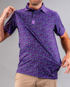 Men’s Doodle Guy Purple golf polo by Pins & Aces featuring an all-over purple, violet, blue, and green doodle-inspired pattern with short sleeves and an athletic performance fit.
