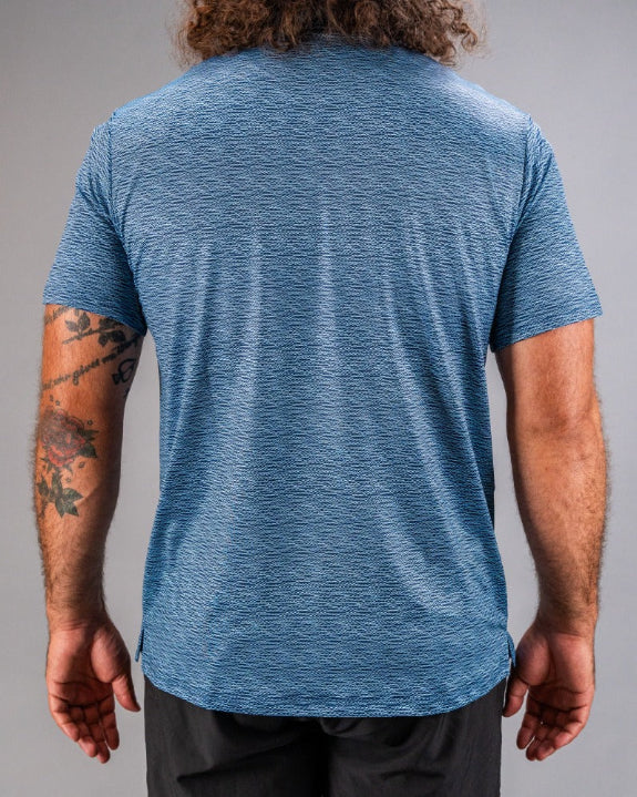 Men’s Squiggle Blue performance golf polo by Pins & Aces featuring a subtle textured blue pattern, short sleeves, and athletic fit.