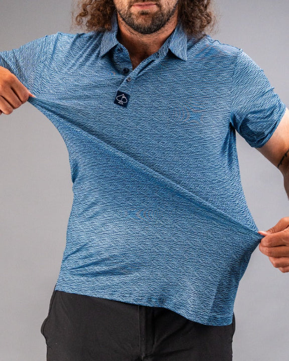 Men’s Squiggle Blue performance golf polo by Pins & Aces featuring a subtle textured blue pattern, short sleeves, and athletic fit.