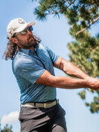Men’s Squiggle Blue performance golf polo by Pins & Aces featuring a subtle textured blue pattern, short sleeves, and athletic fit.