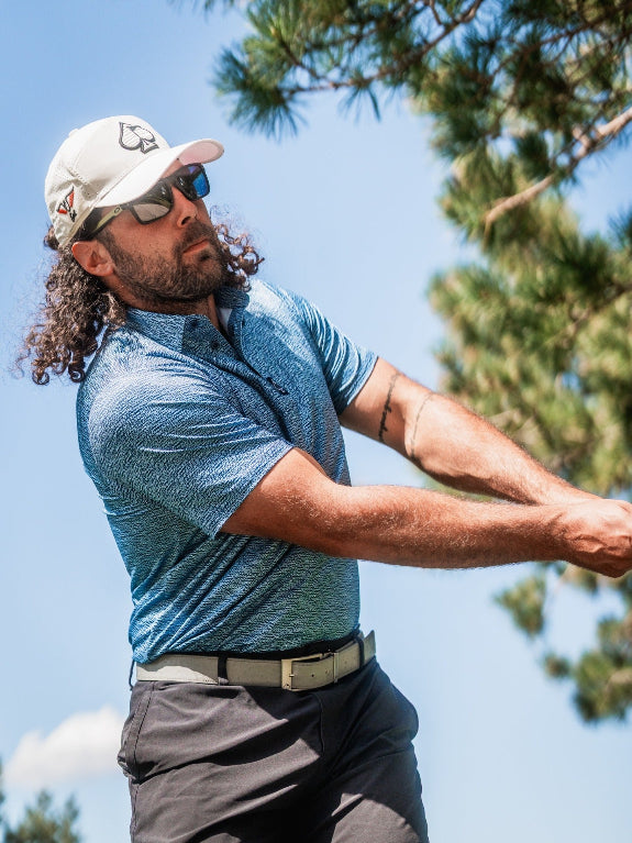 Men’s Squiggle Blue performance golf polo by Pins & Aces featuring a subtle textured blue pattern, short sleeves, and athletic fit.
