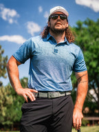 Men’s Squiggle Blue performance golf polo by Pins & Aces featuring a subtle textured blue pattern, short sleeves, and athletic fit.
