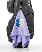 South Park Towelie premium microfiber golf towel from the official Pins & Aces x South Park collection, designed as a lightweight and absorbent golf accessory.