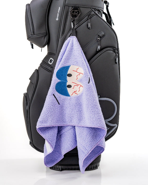 South Park Towelie premium microfiber golf towel from the official Pins & Aces x South Park collection, designed as a lightweight and absorbent golf accessory.