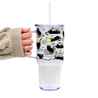 Black Cats on Books drinkware design featuring whimsical black cats lounging on colorful stacks of books with pastel flowers and bookish details.