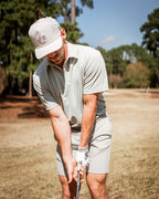 Men’s Origami Player Preferred golf polo by Pins & Aces featuring a sage green tonal geometric pattern, blade collar, short sleeves, and athletic performance fit.