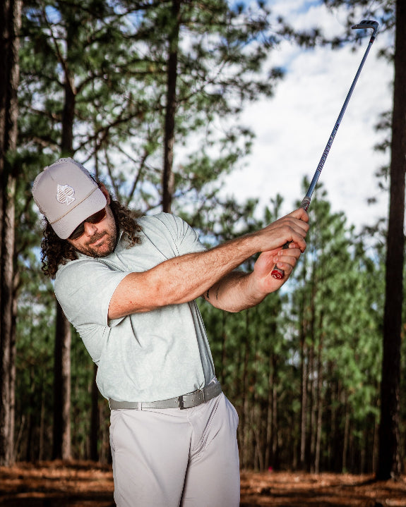 Men’s Pineapples Player Preferred golf polo by Pins & Aces featuring a sage green tonal pineapple print, blade collar, short sleeves, and athletic performance fit.