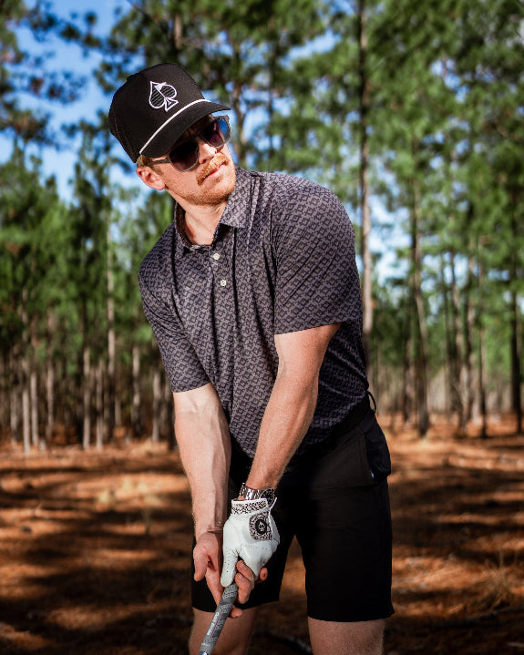 Men’s Slate Mosaic Player Preferred golf polo by Pins & Aces featuring a slate gray geometric pattern, modern blade collar, short sleeves, and athletic performance fit.