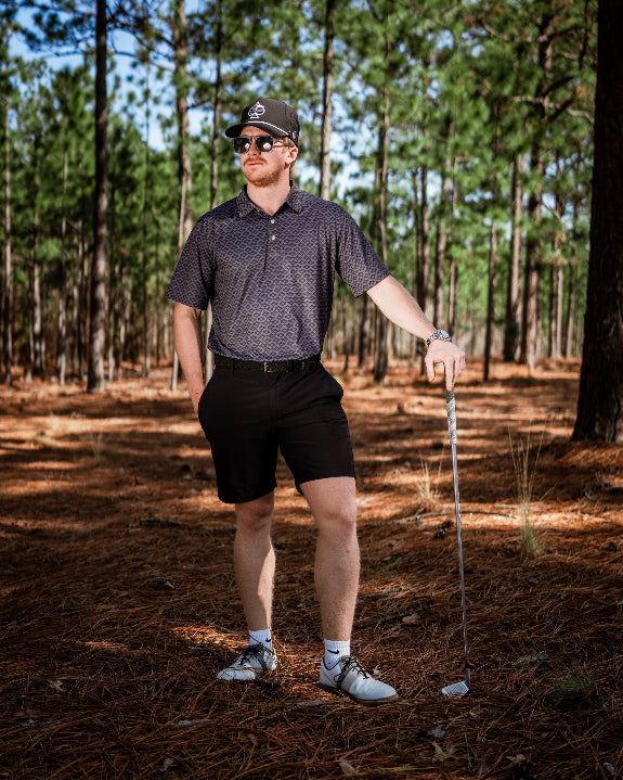 Men’s Slate Mosaic Player Preferred golf polo by Pins & Aces featuring a slate gray geometric pattern, modern blade collar, short sleeves, and athletic performance fit.