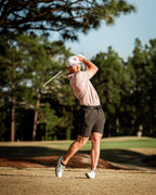 Men’s Sparrows Player Preferred golf polo by Pins & Aces featuring a coral and cream micro-pattern, blade collar, short sleeves, and athletic performance fit.