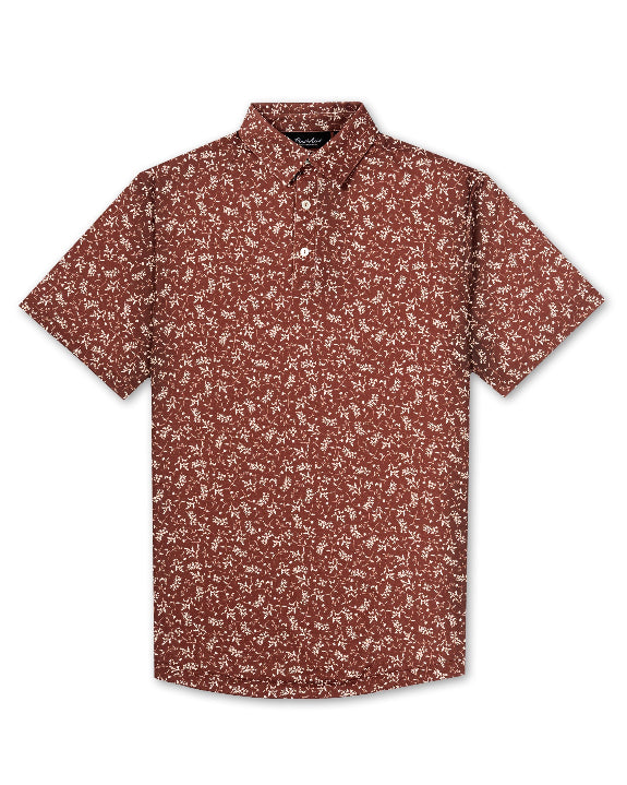 Men’s Autumn Bloom golf polo by Pins & Aces featuring a rust-colored all-over cream floral print, short sleeves, blade collar, and athletic performance fit.
