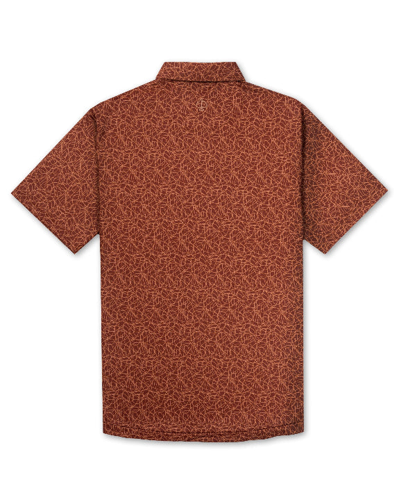 Men’s Filament golf polo by Pins & Aces featuring a rust and burnt orange abstract line pattern, short sleeves, modern blade collar, and athletic performance fit.