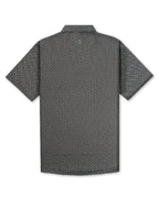 Men’s Jade Drops golf polo by Pins & Aces featuring a dark jade green geometric pattern, modern blade collar, short sleeves, and athletic performance fit.