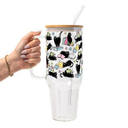 Black Cats on Books drinkware design featuring whimsical black cats lounging on colorful stacks of books with pastel flowers and bookish details.