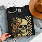 Skull and Flowers Firefly Comfort Colors T-shirt featuring a detailed skull surrounded by blooming flowers and glowing fireflies in a Halloween-inspired graphic design in Black