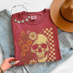 Skull and Flowers Firefly Comfort Colors T-shirt featuring a detailed skull surrounded by blooming flowers and glowing fireflies in a Halloween-inspired graphic design in Crimson