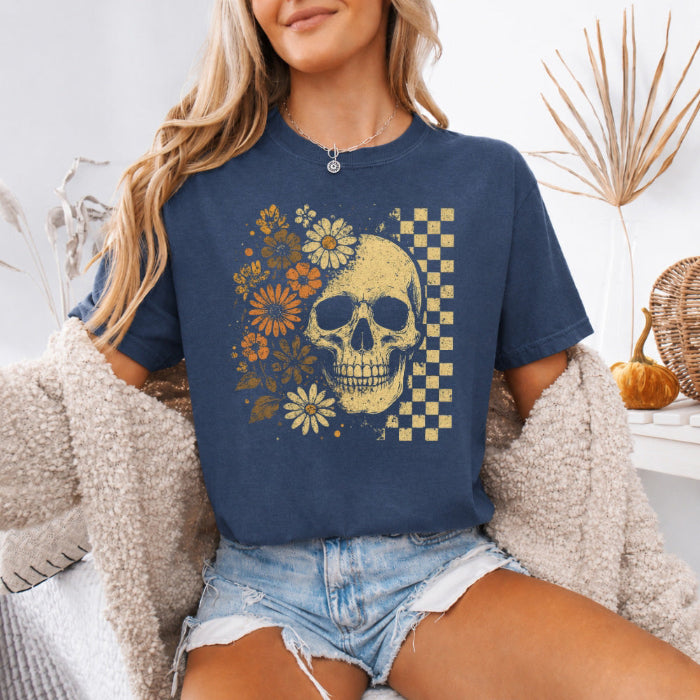 Skull and Flowers Firefly Comfort Colors T-shirt featuring a detailed skull surrounded by blooming flowers and glowing fireflies in a Halloween-inspired graphic design in Denim