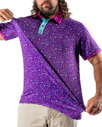 Men’s Eighties Arcade golf polo by Pins & Aces featuring a purple retro geometric print with pink and teal accents, short sleeves, and an athletic performance fit.