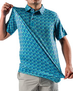 Men’s Fish & Drips golf polo by Pins & Aces featuring a bright aqua blue all-over fish print with colorful fishing-inspired details, short sleeves, and an athletic performance fit.