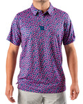 Men’s Full Bloom golf polo by Pins & Aces featuring an all-over bright pink floral pattern on a navy background with short sleeves and an athletic performance fit.