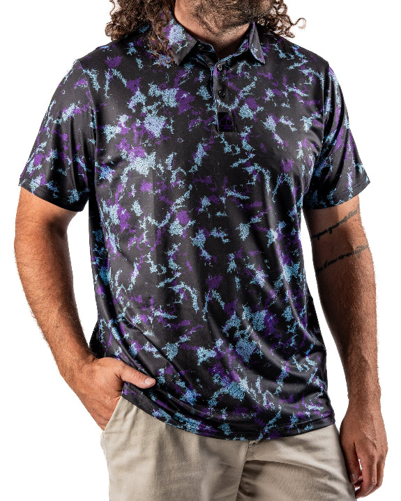 Men’s Moon Burn golf polo by Pins & Aces featuring an abstract purple, blue, and black cosmic-inspired pattern with short sleeves and an athletic performance fit.