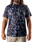 Men’s Moon Burn golf polo by Pins & Aces featuring an abstract purple, blue, and black cosmic-inspired pattern with short sleeves and an athletic performance fit.