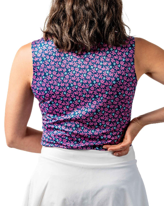 Pins & Aces Women’s Full Bloom performance golf polo featuring a floral-inspired design, women’s athletic fit, fast-wicking fabric and SPF 45+ sun protection.