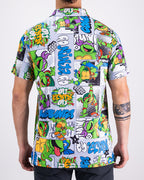 Men’s TMNT Comic Strip golf polo by Pins & Aces featuring colorful Teenage Mutant Ninja Turtles comic artwork in an all-over print.