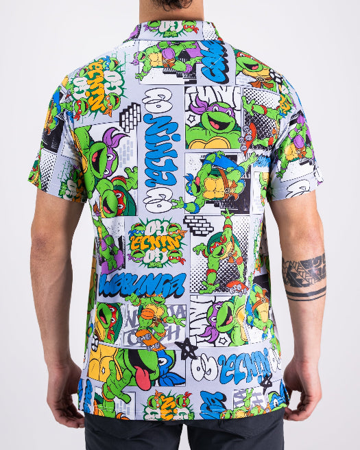 Men’s TMNT Comic Strip golf polo by Pins & Aces featuring colorful Teenage Mutant Ninja Turtles comic artwork in an all-over print.
