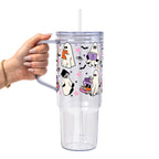 Ghosts and Books drinkware design featuring cute white ghosts reading and carrying colorful books surrounded by black bats and pink, purple and orange stars.