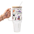 Ghosts and Books drinkware design featuring cute white ghosts reading and carrying colorful books surrounded by black bats and pink, purple and orange stars.