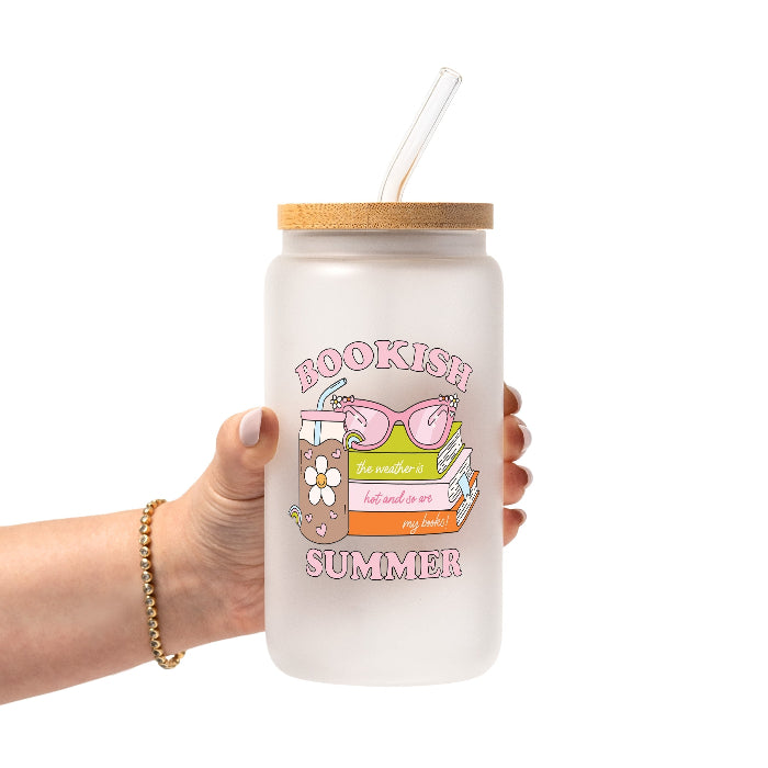 Retro Bookish Summer design featuring stacked books, pink sunglasses, a floral iced drink and the phrase “The weather is hot and so are my books.”
