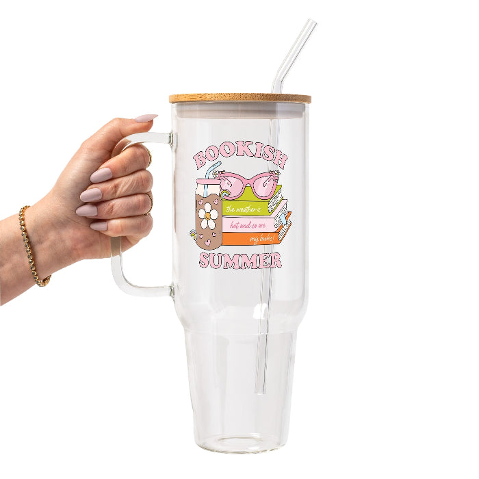 Retro Bookish Summer design featuring stacked books, pink sunglasses, a floral iced drink and the phrase “The weather is hot and so are my books.”