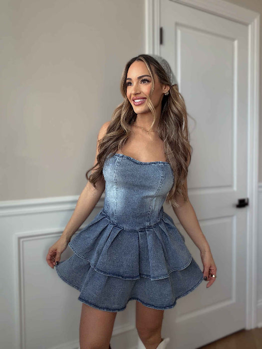 Jolene Strapless Denim Mini Dress featuring a fitted stretch denim bodice, silicone non-slip strapless neckline, ruffled mini skirt, and hidden back zipper for a flattering boutique look.