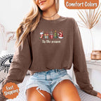 ’Tis The Season Comfort Colors long sleeve Christmas shirt featuring a festive holiday graphic on a soft garment-dyed 100% cotton tee in Espresso