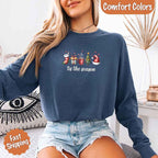 ’Tis The Season Comfort Colors long sleeve Christmas shirt featuring a festive holiday graphic on a soft garment-dyed 100% cotton tee in Blue Jean