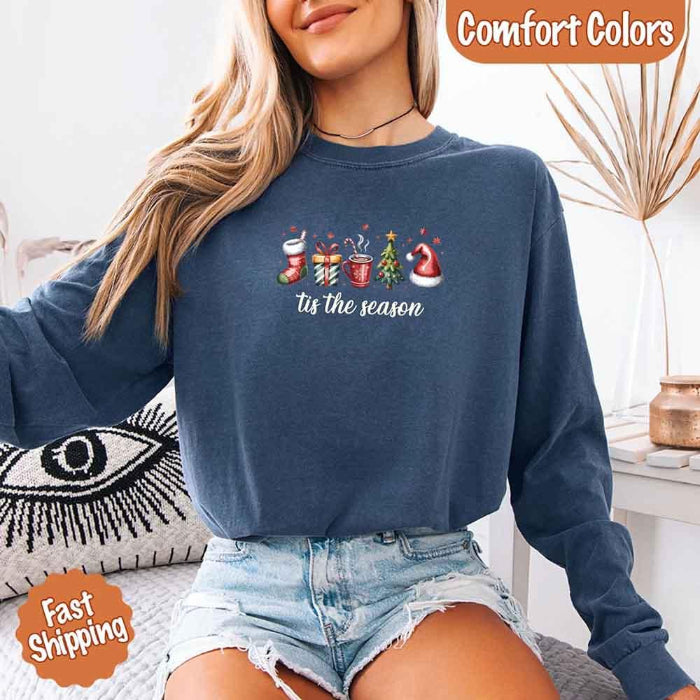 ’Tis The Season Comfort Colors long sleeve Christmas shirt featuring a festive holiday graphic on a soft garment-dyed 100% cotton tee in Blue Jean