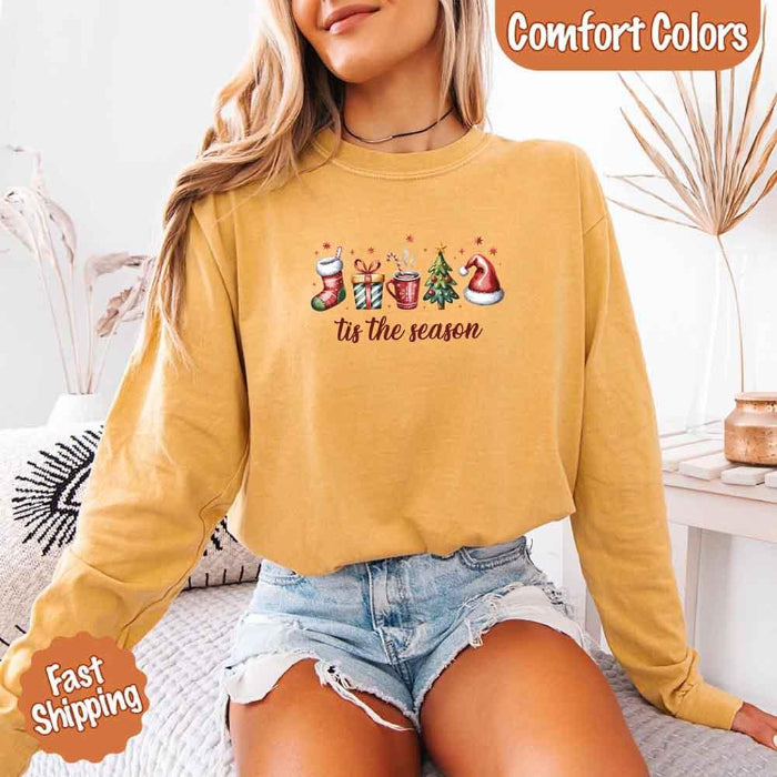’Tis The Season Comfort Colors long sleeve Christmas shirt featuring a festive holiday graphic on a soft garment-dyed 100% cotton tee in Mustard