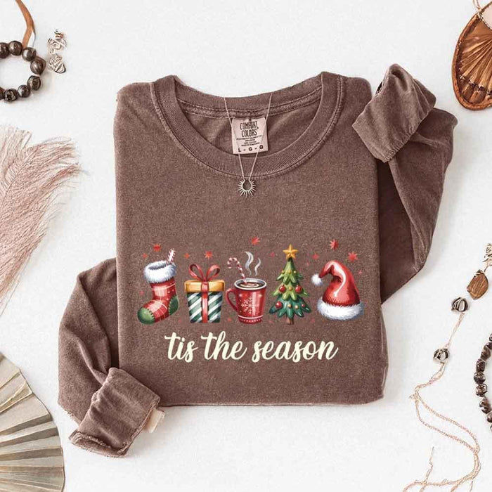 ’Tis The Season Comfort Colors long sleeve Christmas shirt featuring a festive holiday graphic on a soft garment-dyed 100% cotton tee in Espresso