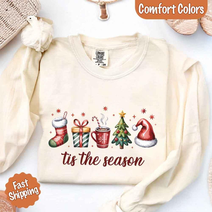’Tis The Season Comfort Colors long sleeve Christmas shirt featuring a festive holiday graphic on a soft garment-dyed 100% cotton tee in Ivory