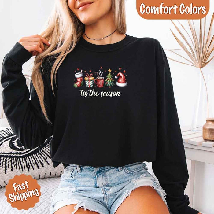 ’Tis The Season Comfort Colors long sleeve Christmas shirt featuring a festive holiday graphic on a soft garment-dyed 100% cotton tee in Black