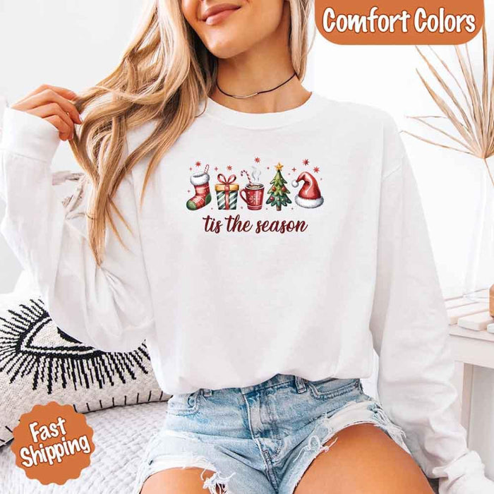 ’Tis The Season Comfort Colors long sleeve Christmas shirt featuring a festive holiday graphic on a soft garment-dyed 100% cotton tee in White