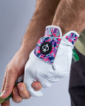 White Pins & Aces Vivid Camo Premium Tour golf glove made from Cabretta leather with perforated fingers and a colorful pink, aqua, purple, and navy camo wrist design.