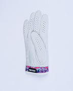 White Pins & Aces Vivid Camo Premium Tour golf glove made from Cabretta leather with perforated fingers and a colorful pink, aqua, purple, and navy camo wrist design.