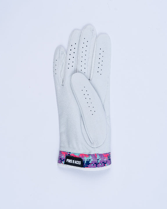 White Pins & Aces Vivid Camo Premium Tour golf glove made from Cabretta leather with perforated fingers and a colorful pink, aqua, purple, and navy camo wrist design.