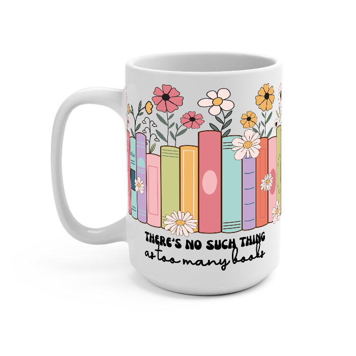 Clear glass cup with bamboo lid and straw featuring colorful pastel books surrounded by pink, yellow and white wildflowers with “There’s No Such Thing as Too Many Books” lettering.