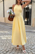 Women’s solid halter midi dress featuring a sleeveless neckline, graceful dropped hem, lightweight stretch fabric, and flowing feminine silhouette.