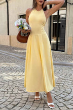 Women’s solid halter midi dress featuring a sleeveless neckline, graceful dropped hem, lightweight stretch fabric, and flowing feminine silhouette.